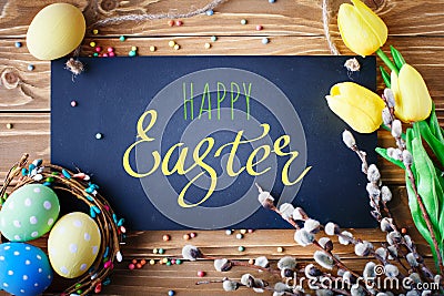 Happy Easter. Congratulatory easter background. Easter eggs and flowers. Stock Photo
