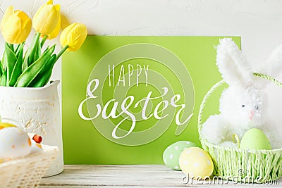 Happy Easter. Congratulatory easter background. Easter eggs and flowers. Stock Photo