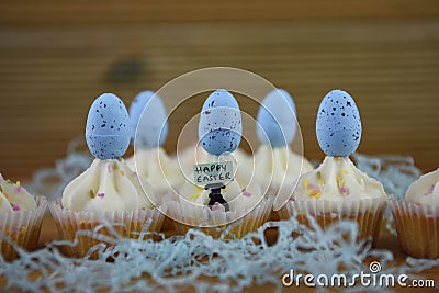 Happy Easter cupcakes with buttercream and decorated with blue speckled Easter eggs Stock Photo