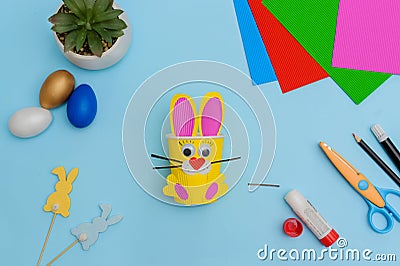 Happy Easter day.Festive craft from a paper cup with your own hands.Leisure for children.A congratulatory gift.Cute yellow Easter Stock Photo