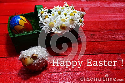 Happy easter decoration with flowers and a easteregg Stock Photo