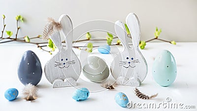 Happy easter. Decorative wooden eggs and funny bunnys on grey background. Festive decoration. Holiday concept Stock Photo