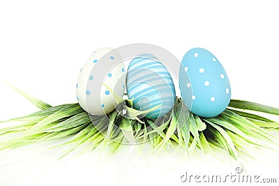 Happy Easter - few eggs with grass on the white background Stock Photo