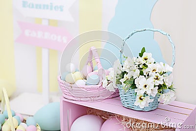 Easter and spring decor. Large multi-colored eggs and Easter bunny. Stock Photo