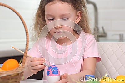 Happy easter. Little girl painting Easter eggs. Happy family children preparing for Easter. Cute little child girl Stock Photo