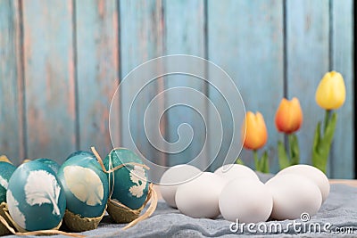 Happy easter, organic easter eggs wait for painting with blue easter eggs, easter holiday decorations, easter concept backgrounds Stock Photo