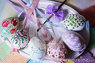 happy easter pastel easteregg table lace ribbon artistic brush painting eggs colorful Stock Photo