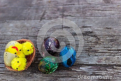 Happy Easter with Rustic still life - easter eggs with birds nest on an old wooden board. Spring, Easter concept Stock Photo