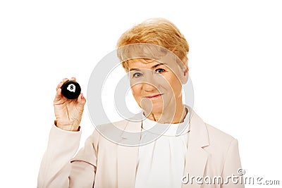 Happy elderly business woman holding eight billard-ball Stock Photo