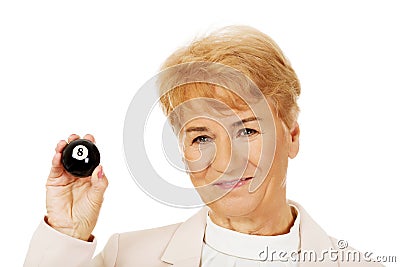 Happy elderly business woman holding eight billard-ball Stock Photo