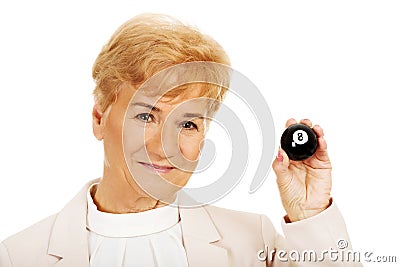 Happy elderly business woman holding eight billard-ball Stock Photo