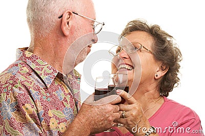 Happy Elderly Couple Toasting Stock Photo