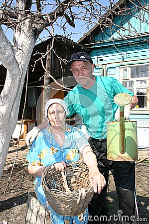 Happy elderly married couple at the cottage home in russia Editorial Stock Photo