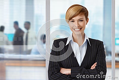 Happy elegant businesswoman at office Stock Photo