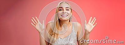 Happy elegant dreamy glamour young blond woman raising hands delight joyfully smiling camera glad see friends comming Stock Photo