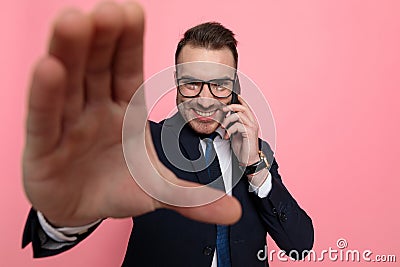Happy elegant man in suit talking on the phone and framing Stock Photo