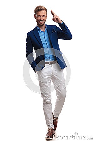 Happy elegant man walking and saluting Stock Photo