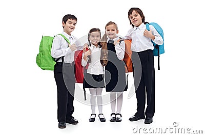 Happy elementary school kids with colorful back packs Stock Photo