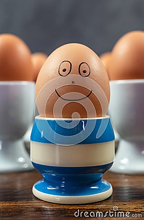 Happy Emotion Individual Concept Boiled Eggs in Egg Cups Stock Photo