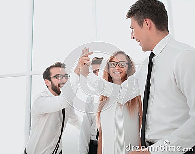 Happy employees standing in spacious office Stock Photo