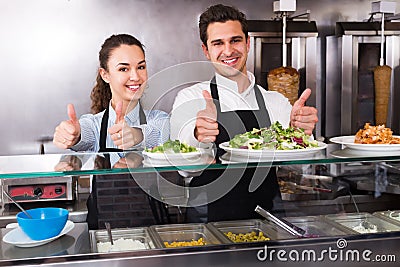 Happy employees working with kebab Stock Photo