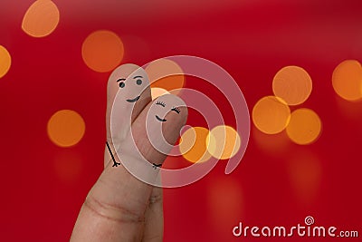 Happy and enamored fingers couple with red background and blur effect, bokeh. Valentines day concept Stock Photo