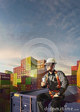 Happy Engineer sit in stack containers. His happy drinking coffee after successful work. Photo with 3d render composing Stock Photo