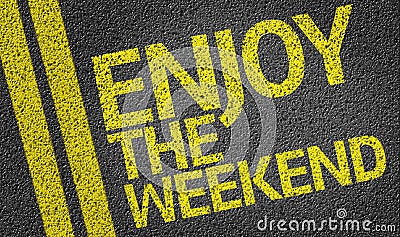 Happy Enjoy the Weekend written on the road Stock Photo