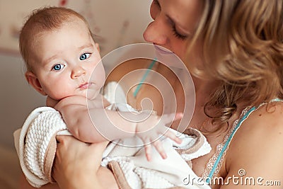 Happy european mother holding newborn baby Stock Photo
