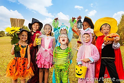 Happy excited kids in Halloween costumes Stock Photo