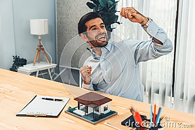 Happy and excited real estate agent closes a deal with buyer. Fervent Stock Photo