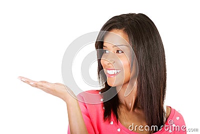 Happy , excited young woman presenting copy space on her palm Stock Photo