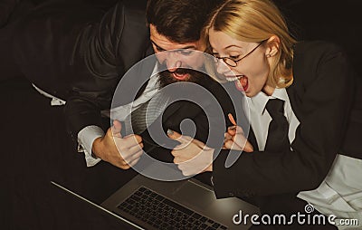 Happy experienced freelancers excited with internet connection on laptop netbook searching information about website. Stock Photo