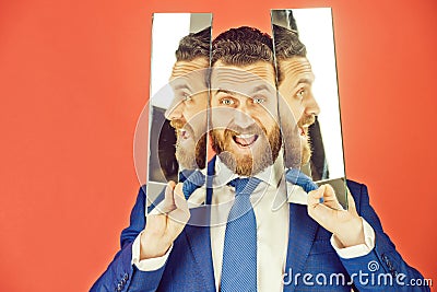 Happy face of bearded hipster man, businessman reflecting in mirror Stock Photo