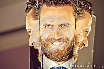 Happy face of bearded hipster man or businessman reflecting in mirror Stock Photo