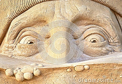 Happy face with eyes as a sculpture in the sand Editorial Stock Photo