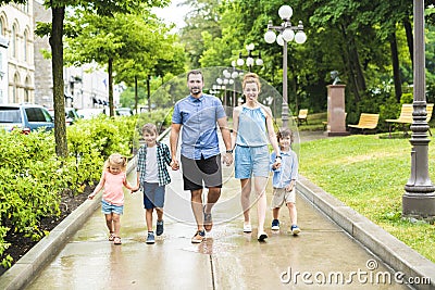 Happy familly of five in the park Stock Photo