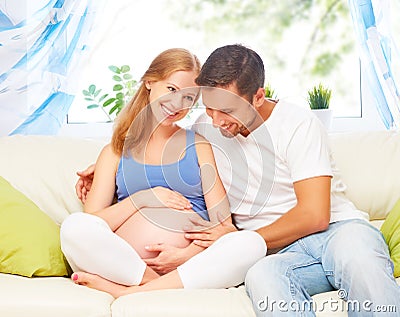 Happy family in anticipation of the birth of baby. Pregnant woma Stock Photo