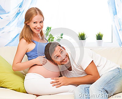 Happy family in anticipation of the birth of baby. Pregnant woma Stock Photo