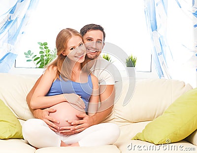 Happy family in anticipation of the birth of baby. Pregnant woma Stock Photo