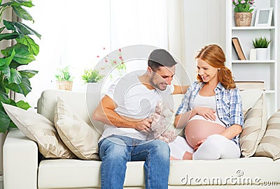 Happy family in anticipation of the birth of baby. Pregnant woma Stock Photo