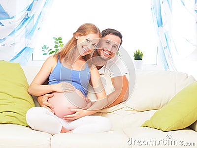 Happy family in anticipation of birth of baby. Pregnant woman an Stock Photo