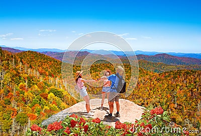 Happy family on autumn hiking trip. Stock Photo