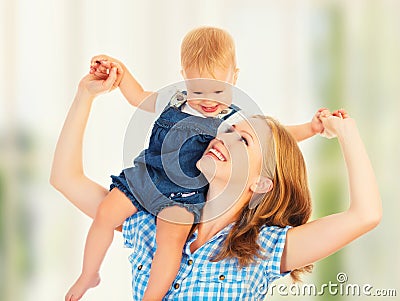 Happy family. baby sits astride the shoulders of the mother Stock Photo