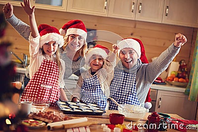 Happy family baking cookies on xmas Stock Photo