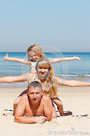 Happy family on the beach Stock Photo