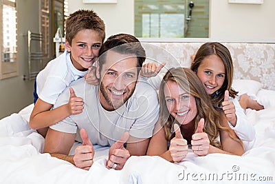 Happy family on the bed Stock Photo