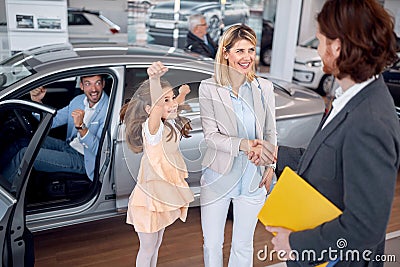 Happy family buying new automobile Stock Photo