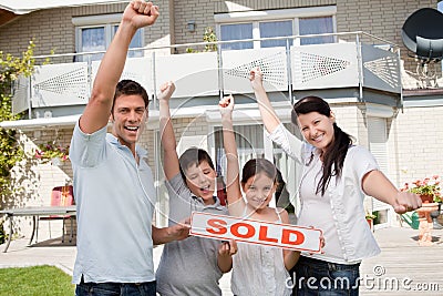 Happy family celebrating buying their new house Stock Photo