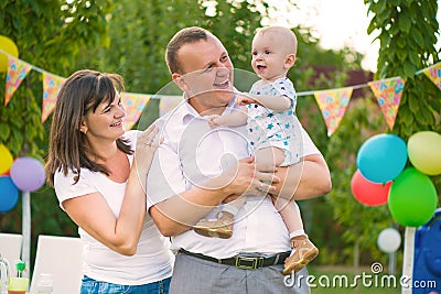 Happy family celebrating first birthday of baby Stock Photo